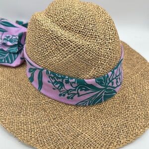 Straw hat with lilac and teal sash